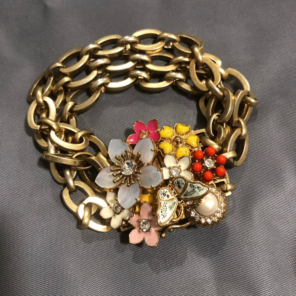 JUICY COUTURE: Gold plated bracelet with flowers